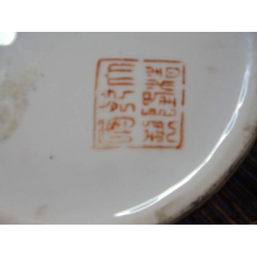 1428 - A hand painted Chinese dish and two hand painted Chinese plates.