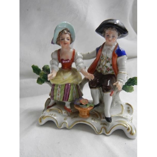 1453 - A Crown Derby figure and two other porcelain figures.