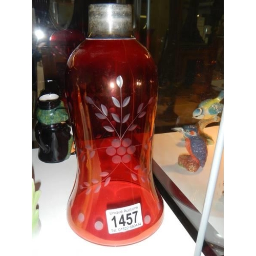 1457 - A cranberry glass lamp shade with silver collar.