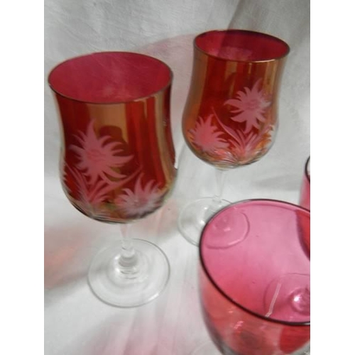 1475 - Six cranberry glasses including four engraved.