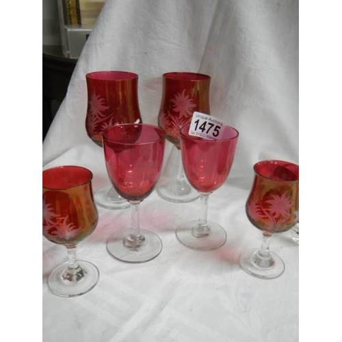 1475 - Six cranberry glasses including four engraved.