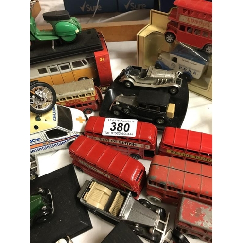 380 - A collection of approx. 32 die cast cars, buses and motor bikes