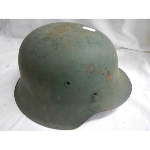 1509 - A WW2 German metal helmet.