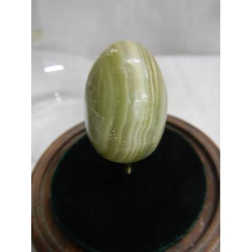 1524 - A mid-20th century Chinese onyx egg under glass dome.