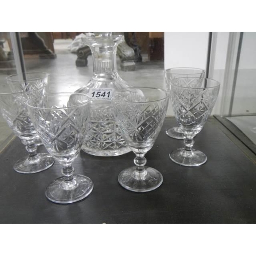 1541 - A cut glass decanter and six glasses.