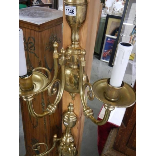 1546 - A set of four superb quality three lamp brass wall lights.