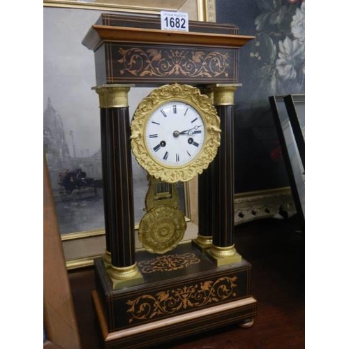 1682 - A four pillar French inlaid mantel clock.