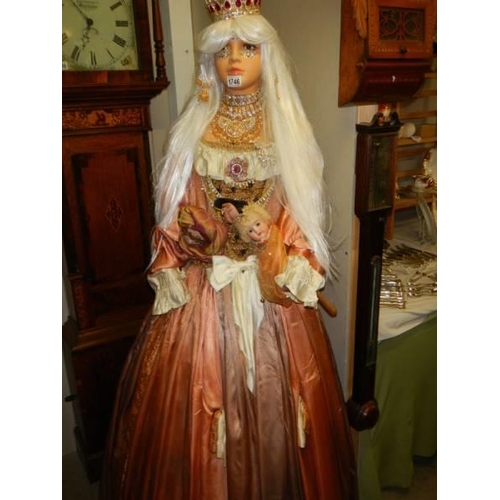 1746 - A life size porcelain doll in an elaborate costume. COLLECT ONLY.