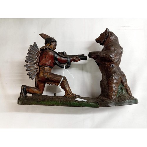 1205 - A mechanical money bank featuring a hunter aimed at a bear.