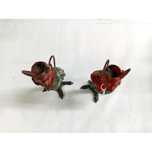 1232 - A pair of Austrian Devil candlesticks (one horn on each devil is missing or damaged).