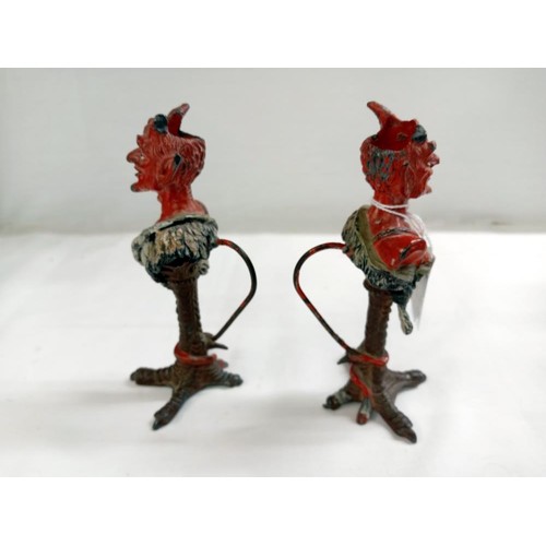 1232 - A pair of Austrian Devil candlesticks (one horn on each devil is missing or damaged).