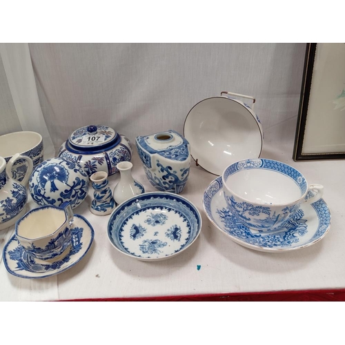 107 - A good lot of blue & white china including large cup & saucer with lozenge mark