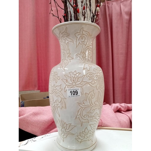 109 - A tall ceramic vase.