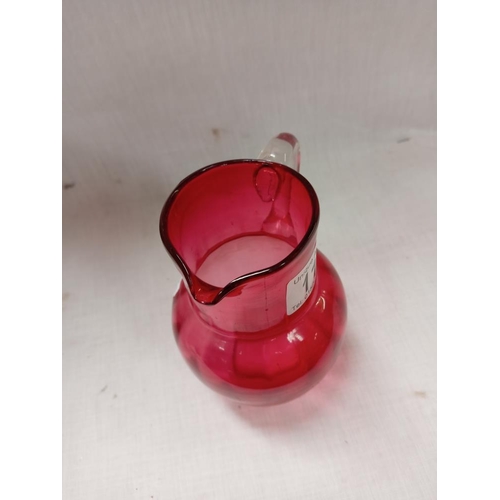 117 - A cranberry jug