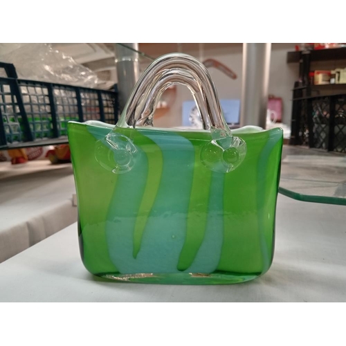 173 - An art glass handbag by Laguna. Height 15cm