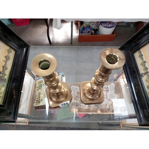 194 - A pair of Victorian brass candlesticks