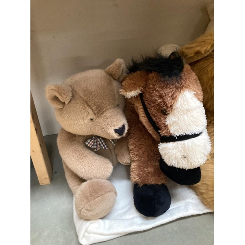 21 - A collection of teddys and a horse