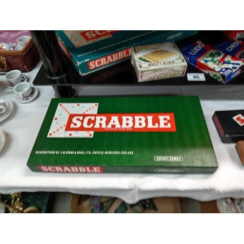 46 - A quantity of games including Scrabble & cribbage board