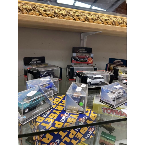 71 - A quantity of boxed diecast cars by Cararama, matchbox etc