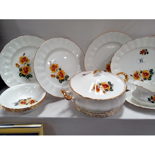 93 - A bone china dinner set featuring yellow roses.