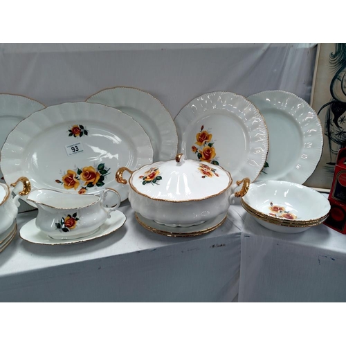 93 - A bone china dinner set featuring yellow roses.