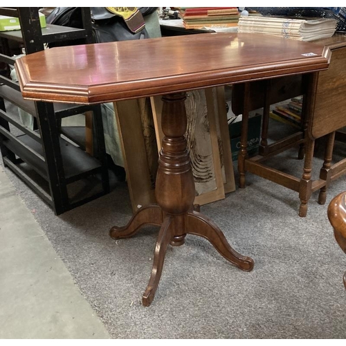 255 - An octagonal mahogany occasional/hall table  on turned pedestal  79h x 61 x  93 cm. COLLECT ONLY