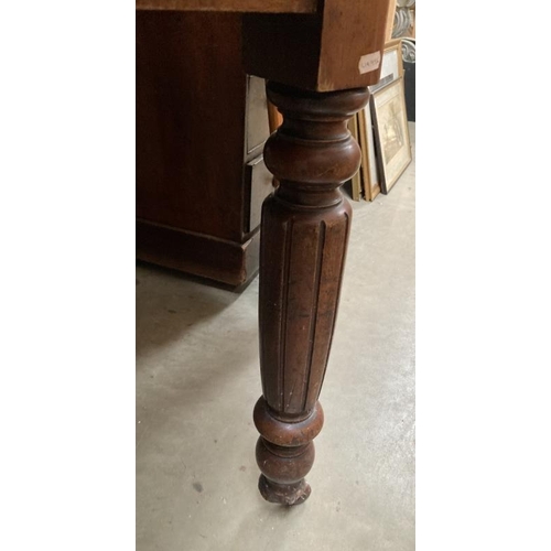 262 - A late 19th early 20thc Mahogany dining table over turned and reeded legs on brass and ceramic casto... 