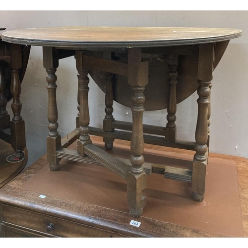 263 - A solid oak dropleaf table over turned legs needs refinishing  99w x 49cm plus two 47cm leaves. COLL... 