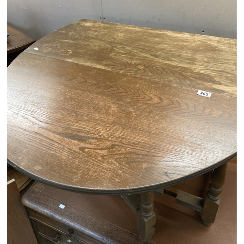 263 - A solid oak dropleaf table over turned legs needs refinishing  99w x 49cm plus two 47cm leaves. COLL... 