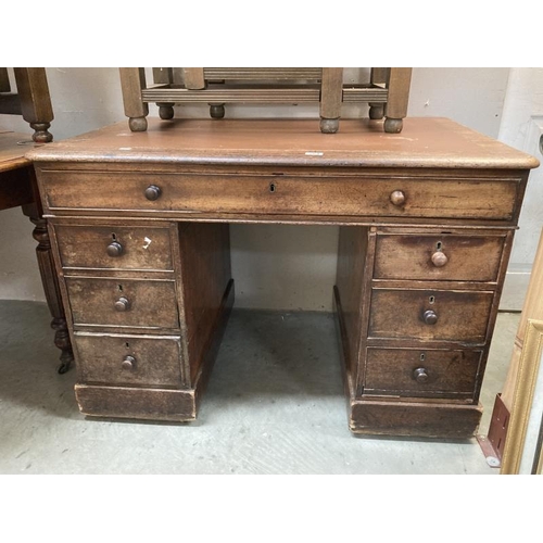 264 - A Mahogany twin pedestal clerks desk with brown leather top  comes apart to transport brass castors ... 