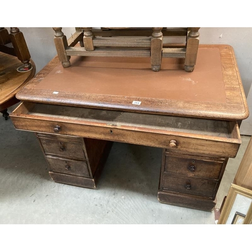 264 - A Mahogany twin pedestal clerks desk with brown leather top  comes apart to transport brass castors ... 