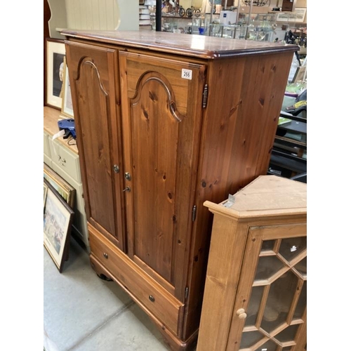 266 - A Ducal pine hall robe/cupboard with hanging rail and drawer under. 145h x 87w x 53d COLLECT ONLY