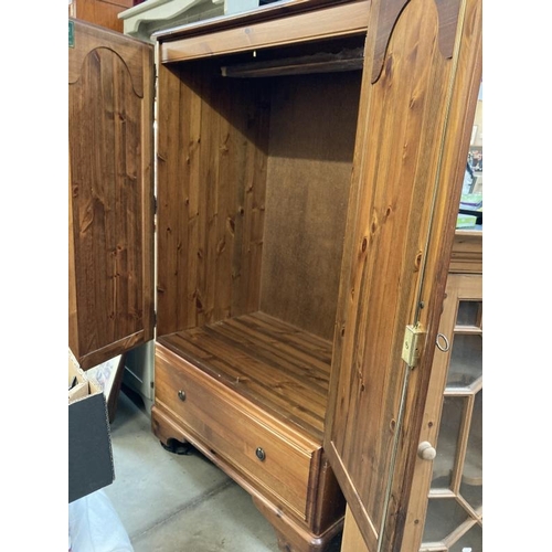 266 - A Ducal pine hall robe/cupboard with hanging rail and drawer under. 145h x 87w x 53d COLLECT ONLY