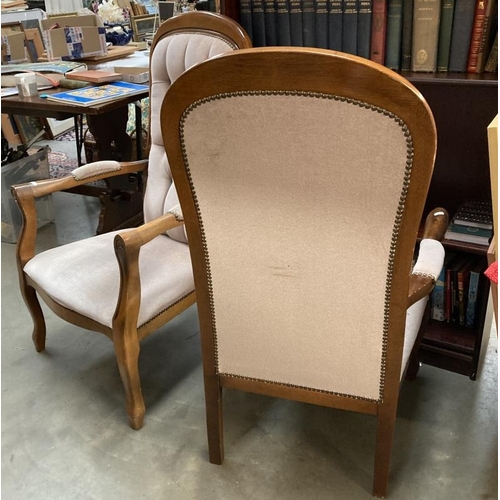 273 - A pair of unholstered button back arm chairs