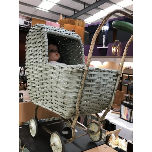 237 - A vintage Wicker dolls pram