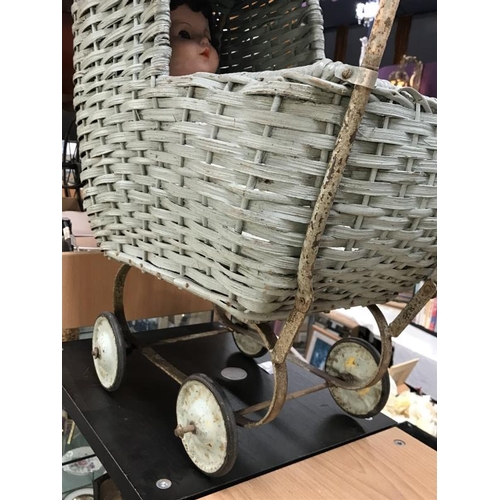 237 - A vintage Wicker dolls pram