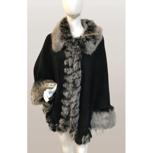 2063 - Sioni designed knitted cape with faux Fur from trim size S/M