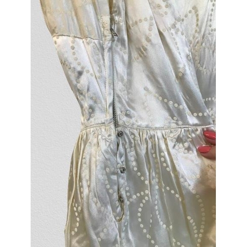 2086 - An original true vintage wedding dress, full length, circa 1940's 1950's in floral embossed silk, de... 