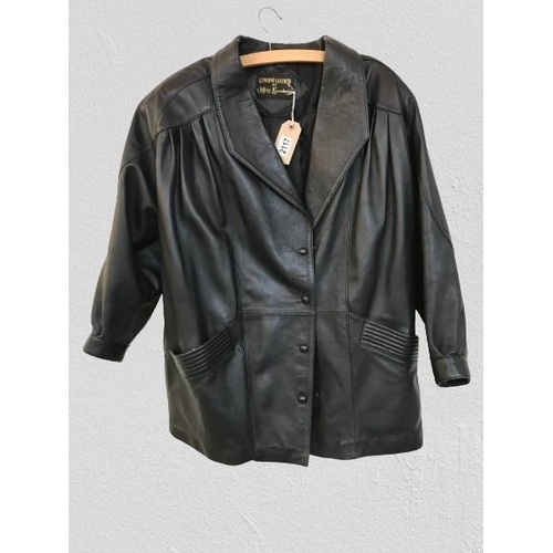 2117 - A leather coat by Jeffrey Brownleader. slight wear in places