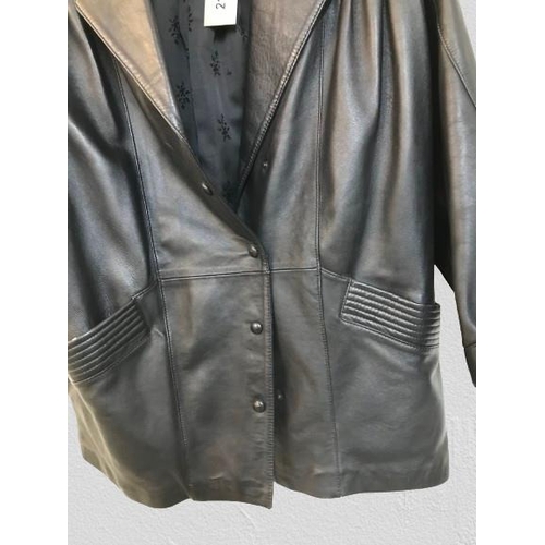 2117 - A leather coat by Jeffrey Brownleader. slight wear in places