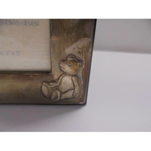 20 - A wooden trinket box with hall marked silver top featuring a teddy bear.