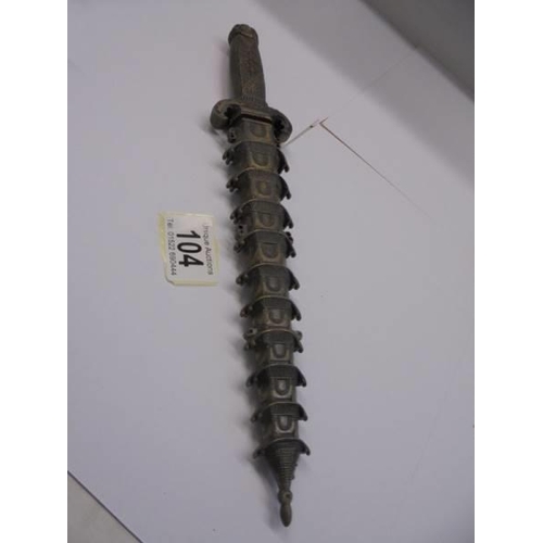 104 - A Chinese dagger in a pagoda style scabbard.