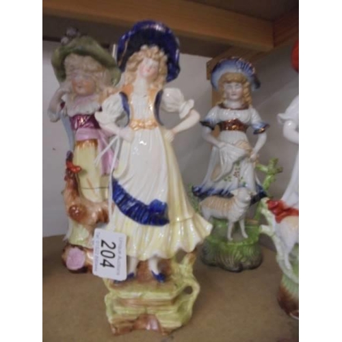 204 - Six 19th century ceramic figures including two pairs.