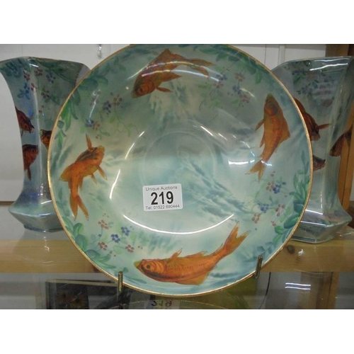 219 - An unusual Burleigh ware bowl decorated with fish and a pair of matching vases.