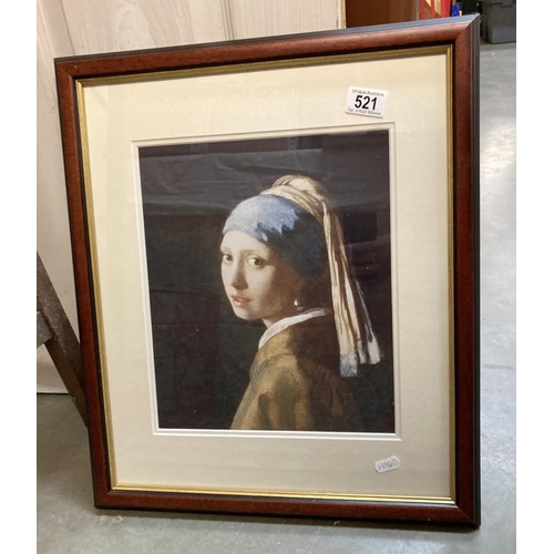 521 - A framed and glazed print of a lady, Girl With Pearl Earring.