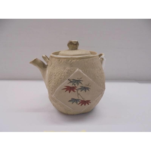 231 - A miniature Chinese hand painted porcelain tea pot.