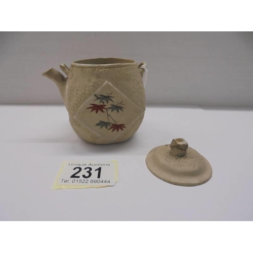 231 - A miniature Chinese hand painted porcelain tea pot.