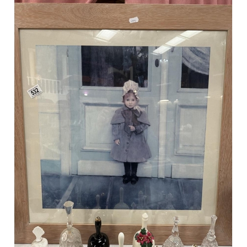 532 - A large framed print of a girl. 70 x 70cm