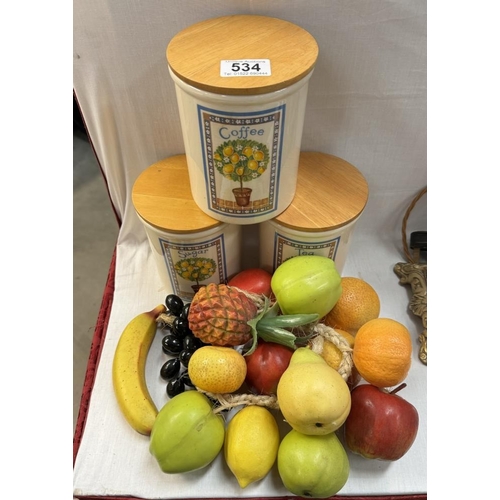 534 - A set of 'Oranges & Lemons' Tea, coffee & Sugar cannisters & A quantity of plastic fruit