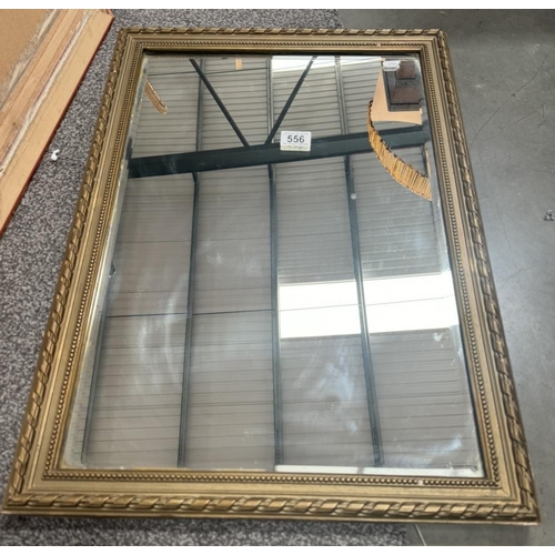 556 - A gilt framed mirror. 66 x 47cm